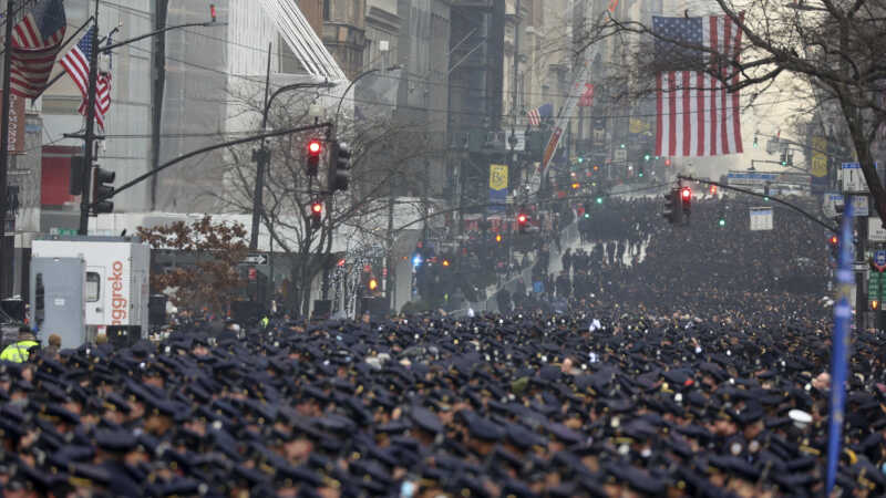 Photo of New York Police officers gathering along Fifth Avenue for the funeral of Officer Jason Rivera