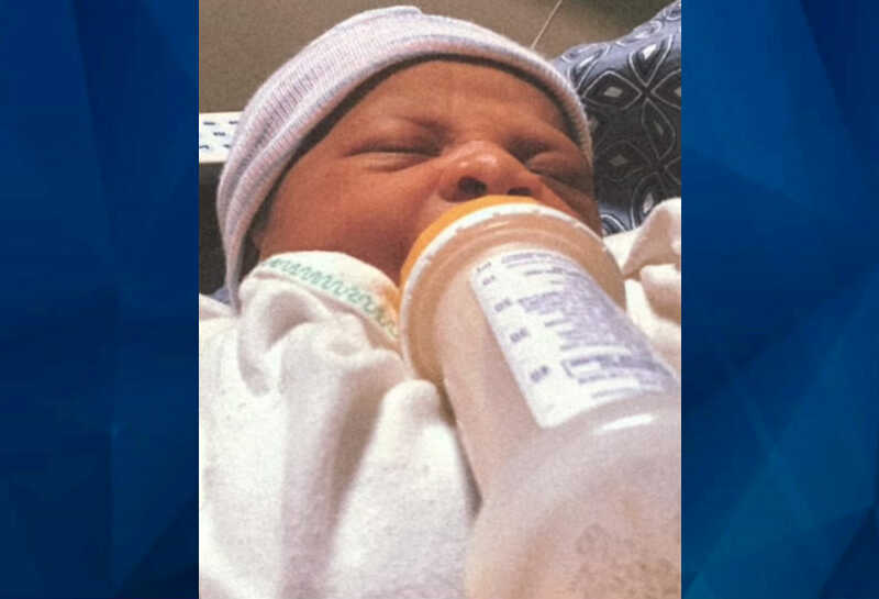 newborn with bottle