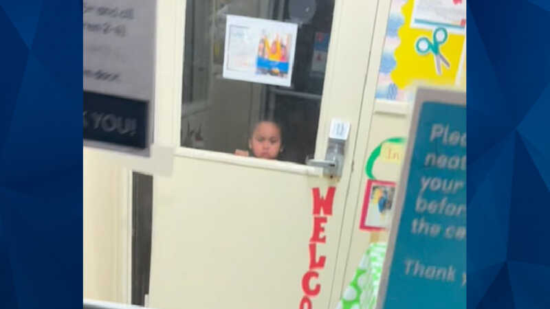 Toddler inside dark room