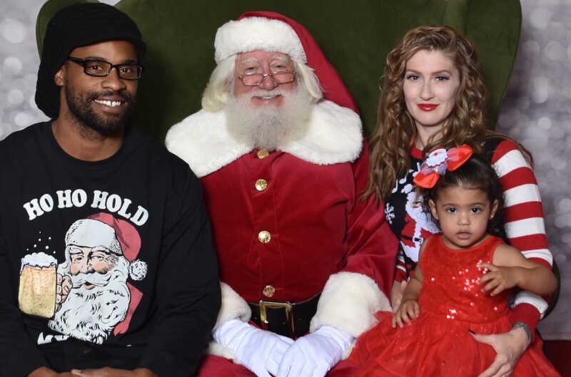 Photo of Rita and Marcus Buchanan with toddler daughter