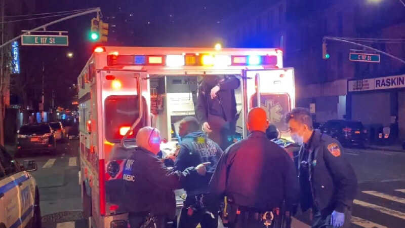 Paramedics loading a victim into ambulance