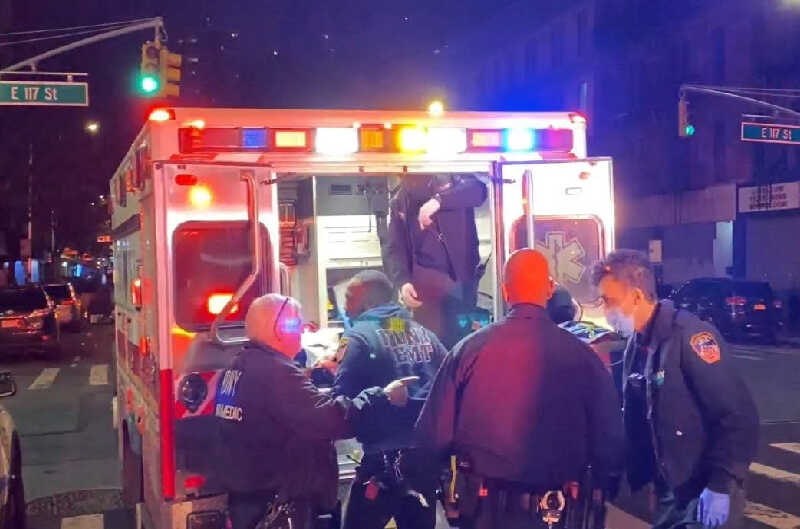 Paramedics loading a victim into ambulance