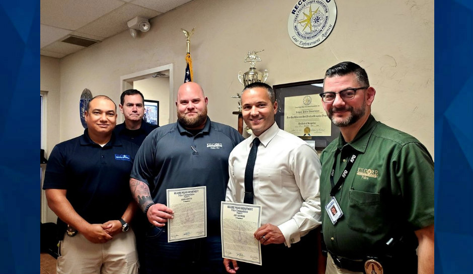 officers smiling with award