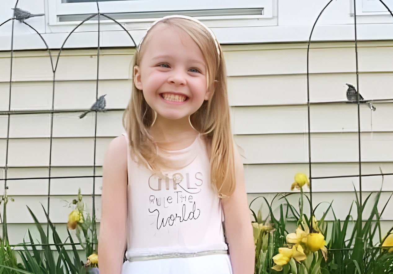 Harmony Montgomery in white dress, smiling