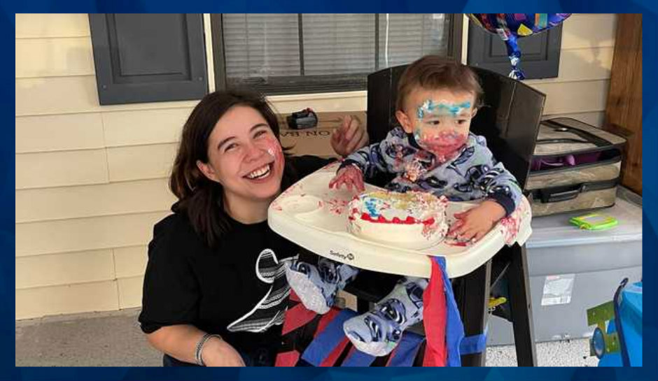 Quinton Simon in high chair, cake on his face