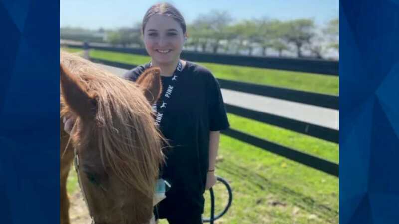 Alexis "Lexi" Marrero standing by horse