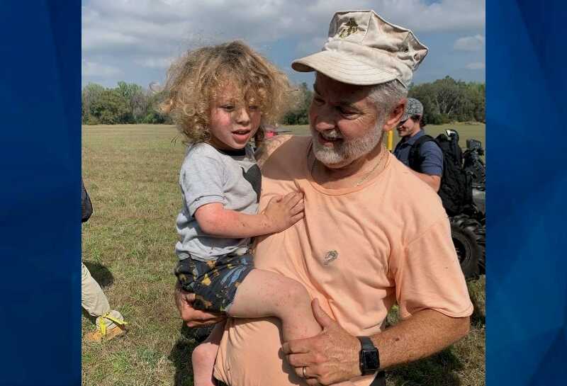 tot with volunteer who found him