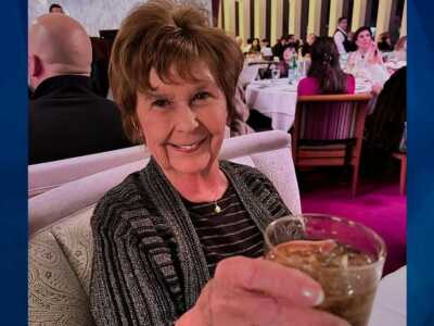 Nancy Guthrie holding glass