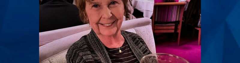 Nancy Guthrie holding glass