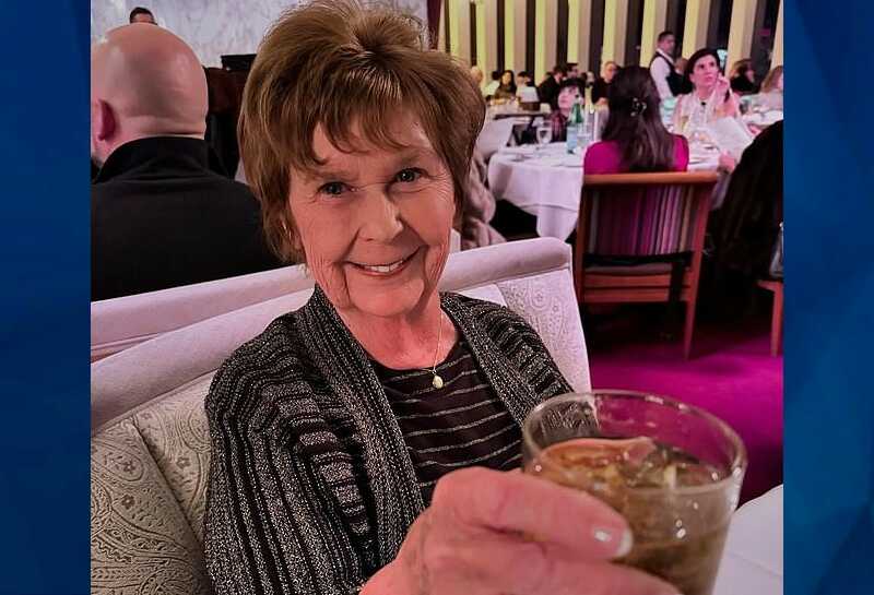 Nancy Guthrie holding glass