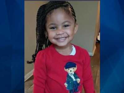 Genesis Reid in red sweater