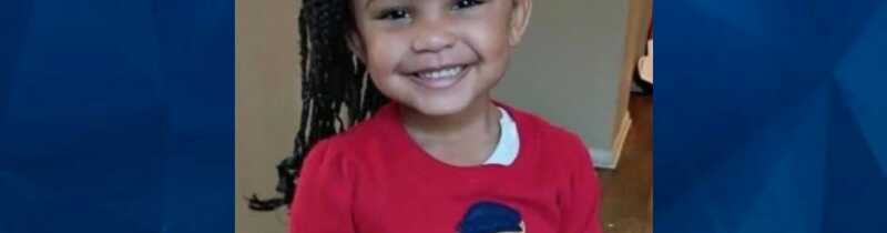 Genesis Reid in red sweater