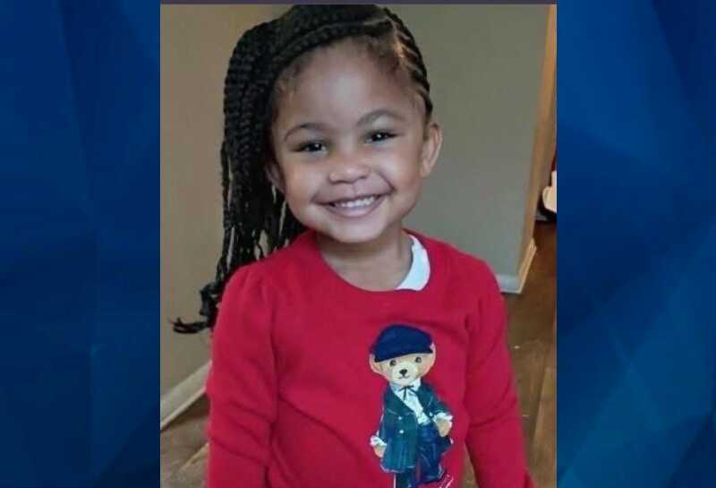 Genesis Reid in red sweater